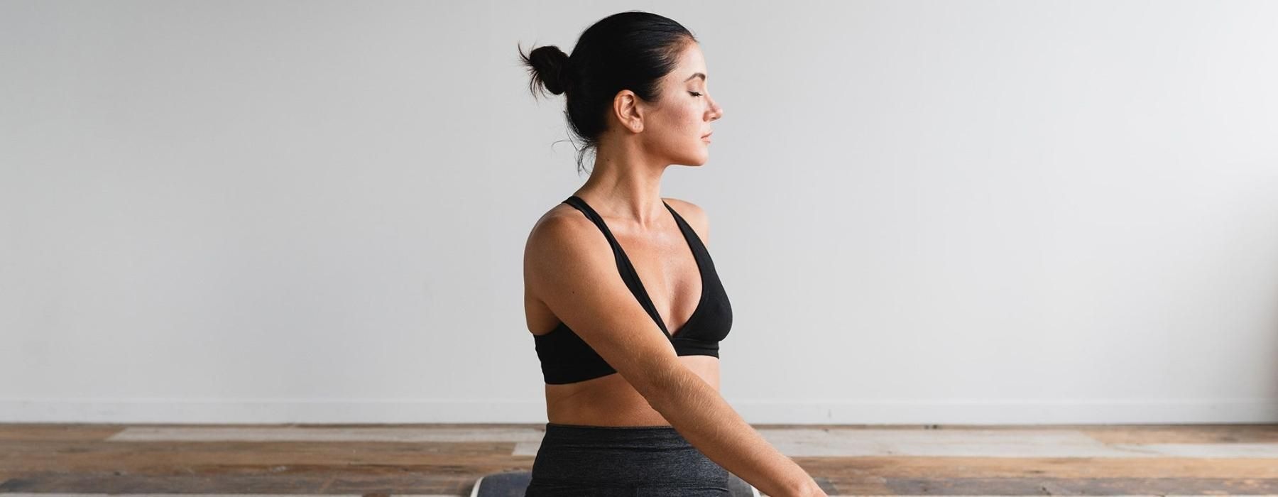 woman stretching on a yoga mat