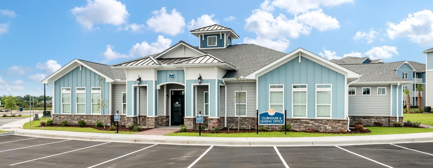 a large building with a parking lot